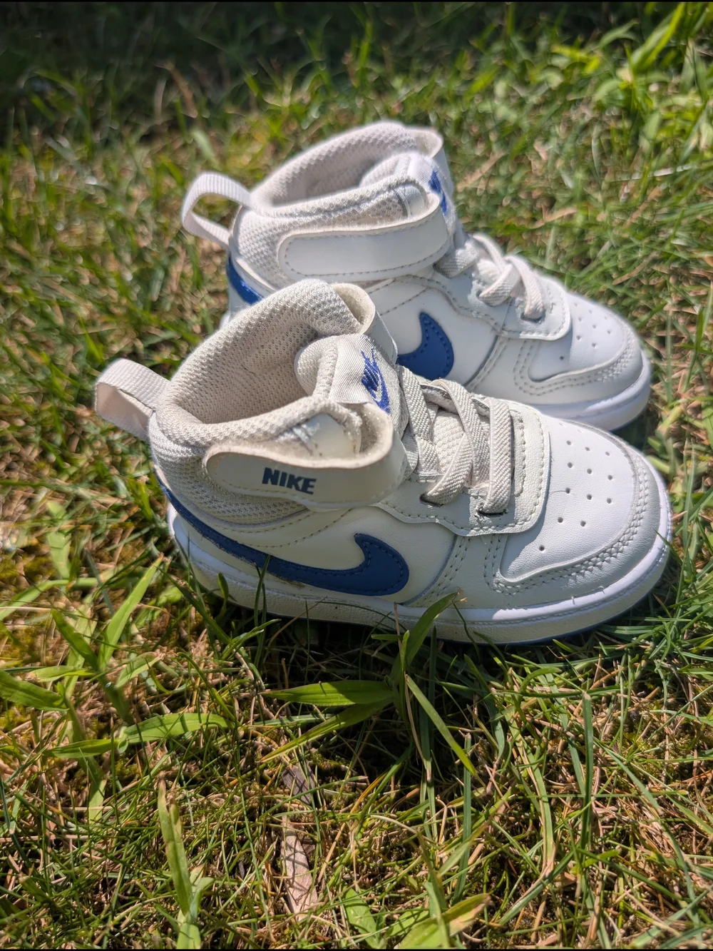Nike Toddler White Sneakers with Blue Swoosh